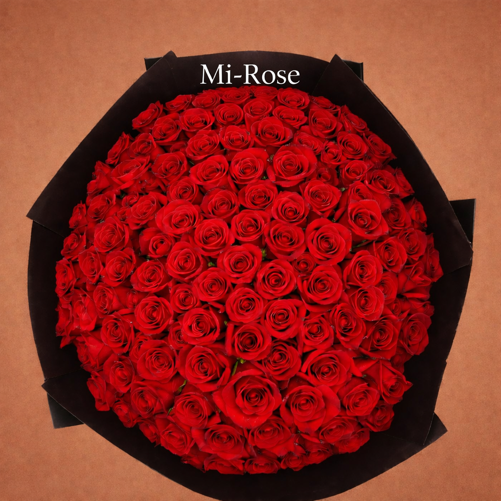 Bouquet of red roses in a black box with 'Mi-Rose' branding on a brown background
