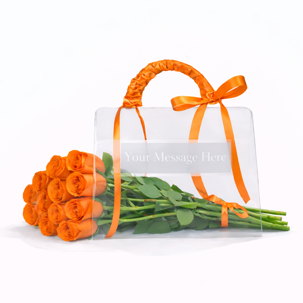 Bouquet of orange roses with a clear bag and orange ribbon on a white background