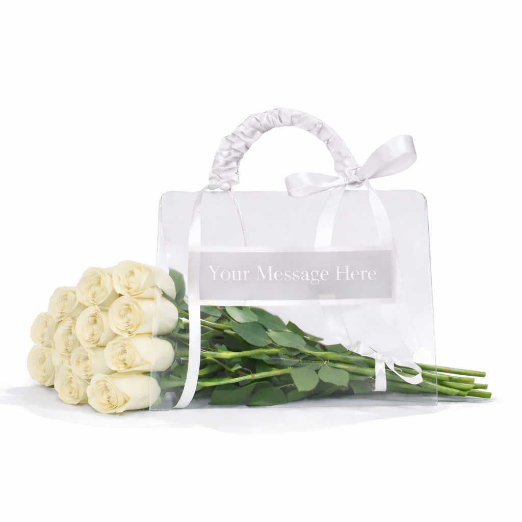 Bouquet of white roses in a clear plastic bag with a white handle on a white background.