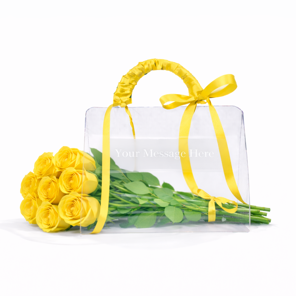 Clear handbag with yellow ribbon and bouquet of yellow roses on a white background