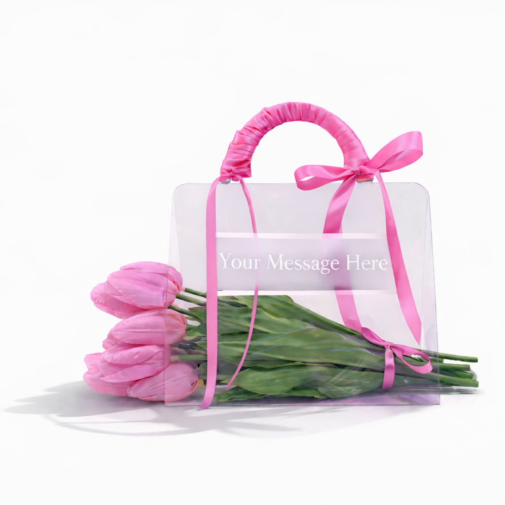 Clear bag with pink tulips and a pink ribbon on a white background