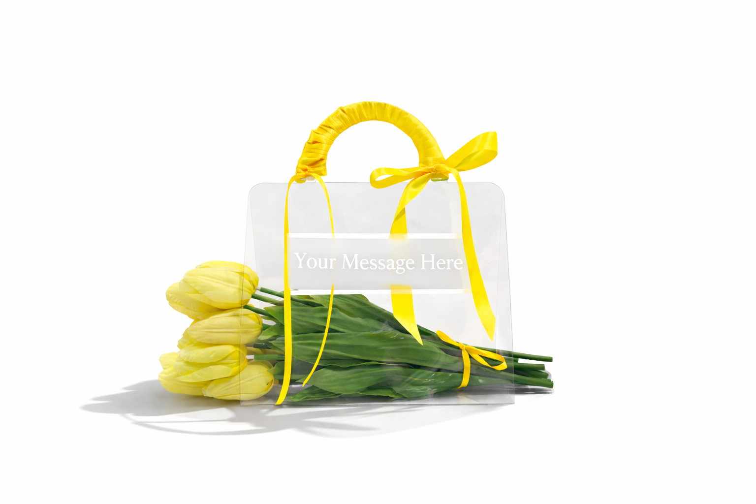 Clear bag with yellow tulips and a yellow ribbon on a white background